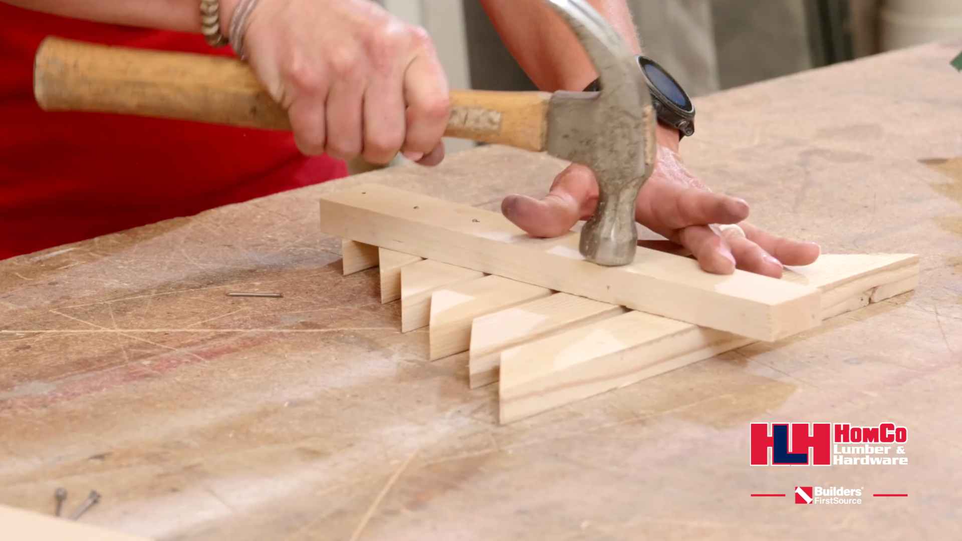 wooden tree being hammered together